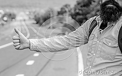 Usually use thumb up to inform drivers hitchhiking. But in some cultures gesture offensive so you risk to be killed by Stock Photo