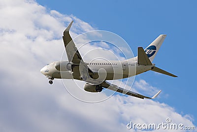 Utair Boeing 737-500 landing at Pulkovo international airport. Editorial Stock Photo