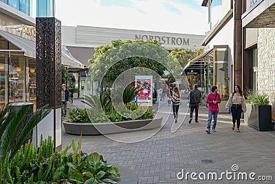 Outdoor shopping center with upmarket chain retailers, a movie theater, restaurants. Editorial Stock Photo