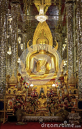 Uthai Thani. Thailand - June 19, 2019 Golden Buddha statue at Cathedral glass.Wat Tha-sung The best of Buddha in Uthai Thani Editorial Stock Photo