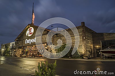 Utica, New York, USA - SEPTEMBER 3, 2018: Bass Pro Shops exterior sign and logo during night. Bass Pro Shops is a retailer of hunt Editorial Stock Photo