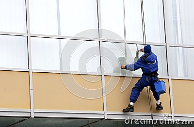 Utilitary alpinist windows cleaner Editorial Stock Photo