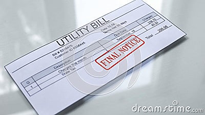 Utility bill final notice, seal stamped on document, payment for month services Stock Photo