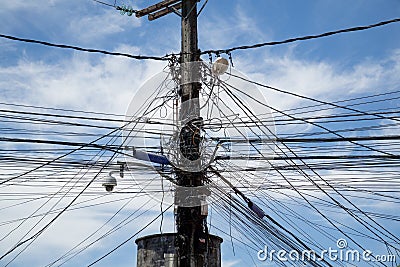 Utility Pole full of wire and cables Stock Photo