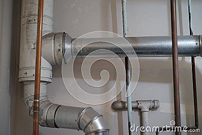 Utility room pipes and exhaust vents Stock Photo