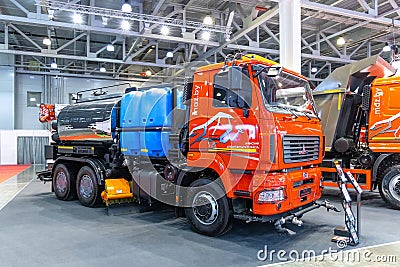 Utility vehicle for cleaning streets based on the MAZ truck. MAZ trucks stand at the construction industry exhibition Editorial Stock Photo