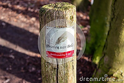 Brieven van Belle walking route sign on wooden pole Editorial Stock Photo