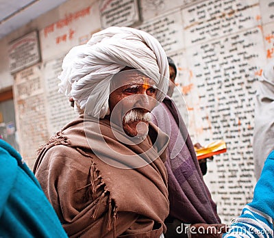 Elderly Indian man walking in the crowd Editorial Stock Photo