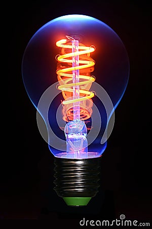 UV induced fluorescence photo of a led filament lamp Stock Photo