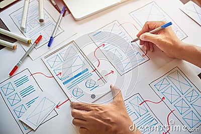 Ux Graphic designer creative sketch planning application process development prototype wireframe for web mobile phone . User Stock Photo