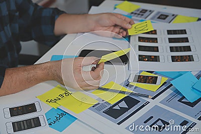 ux Graphic designer creative sketch planning application process development prototype wireframe for web mobile phone . User Stock Photo