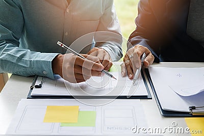 UX or UI designers designing on their smartphone application layout prototype project Stock Photo