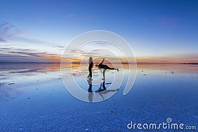 Uyuni reflections are one of the most amazing things that a photographer can see. Here we can see how the sunrise over an infinite Stock Photo