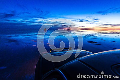 Uyuni reflections are one of the most amazing things that a photographer can see. Here we can see how the sunrise over an infinite Stock Photo