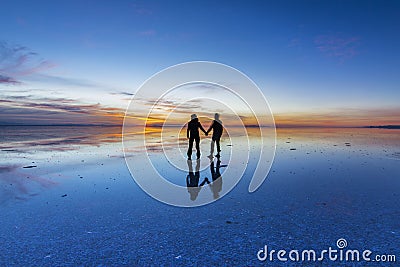 Uyuni reflections are one of the most amazing things that a photographer can see. Here we can see how the sunrise over an infinite Stock Photo