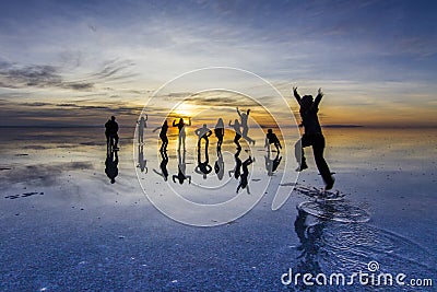 Uyuni reflections are one of the most amazing things that a photographer can see. Here we can see how the sunrise over an infinite Stock Photo