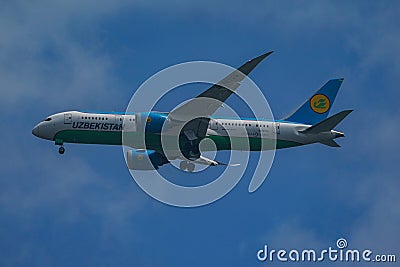 Uzbekistan Airways Boeing 787 Dreamliner descends for landing at JFK International Airport in New York Editorial Stock Photo