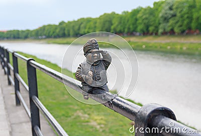 Uzhgorod, Ukraine - April 27, 2016: Small bronze statue of Good Soldier Svejk attached to the handrails at Kyivska embankment of Editorial Stock Photo