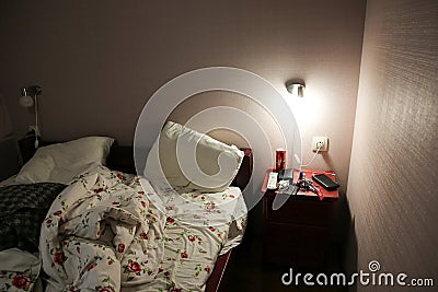 UZHHOROD, UKRAINE - APRIL 14, 2019: Hotel room. Bedside table with things. Tourist concept. Travelling Editorial Stock Photo