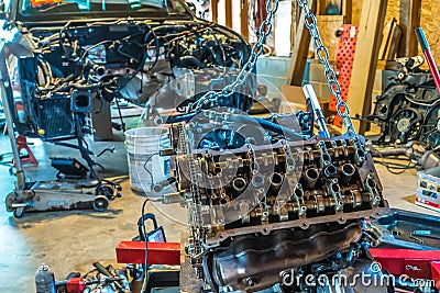 V8 engine from car being rebuilt in garage Stock Photo