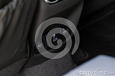 12V and 220v power outlet socket in the car. Stock Photo