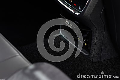 12V and 220v power outlet socket in the car. Stock Photo