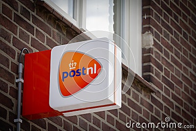VAALS, NETHERLANDS - NOVEMBER 8, 2022: PostNL logo on their office in Vaals. PostNL, or Post NL is a dutch mail parcel and Editorial Stock Photo