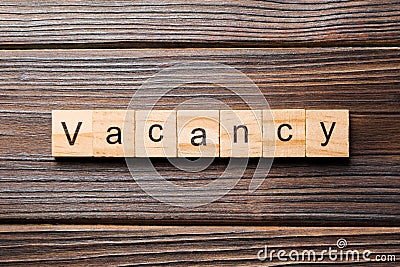 Vacancy word written on wood block. Vacancy text on wooden table for your desing, concept Stock Photo