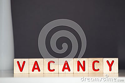 Vacancy word written on wood block. Vacancy text on wooden table for your desing, concept Stock Photo