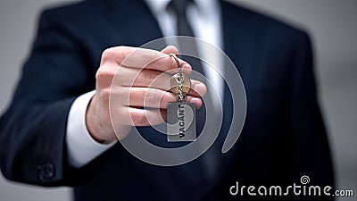 Vacant word on keychain in businessman hand, available room in hotel, closeup Stock Photo