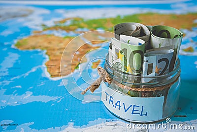 Vacation budget concept. Vacation money savings in a glass jar Stock Photo