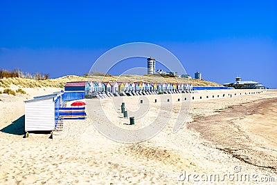 Vacation homes standing along the coastline. with a looming modern city at the background. Summer concept. Vacation rentals. Stock Photo