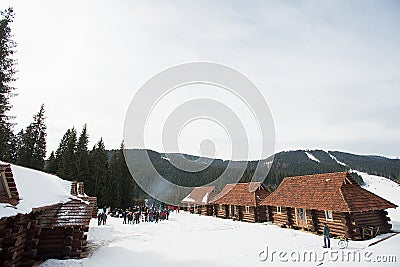 Vacation mountain log house in the ski resort. Winter wonderland Stock Photo