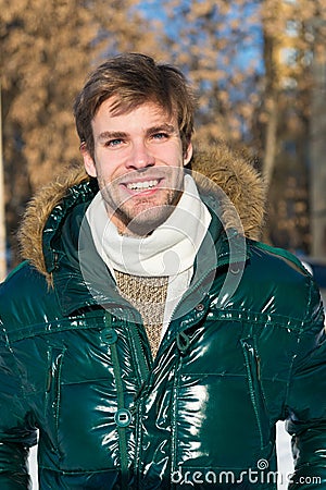 Vacation and traveling. Snowy weather. Trendy winter coat. Man. It is cold outside. Forest in snow. Fresh air. Happy man Stock Photo