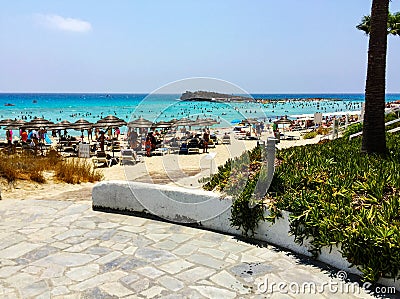 Vacation in tropical countries. Beach chairs, umbrella on the beach Stock Photo