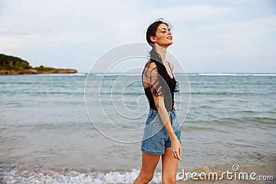 vacation woman coast beach sea ocean sand sunset lifestyle summer smile Stock Photo