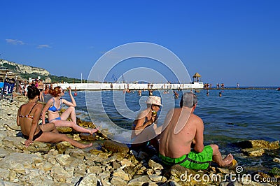 Vacationers relaxing on Balchik beach Editorial Stock Photo