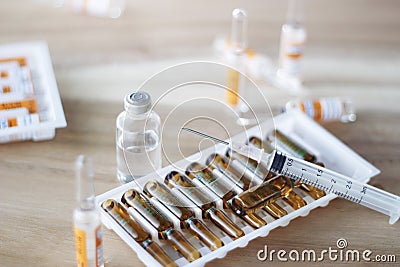 Medicine and syringe on table background, Healthcare and medical Stock Photo
