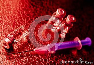 Vaccine bottles and needle Stock Photo