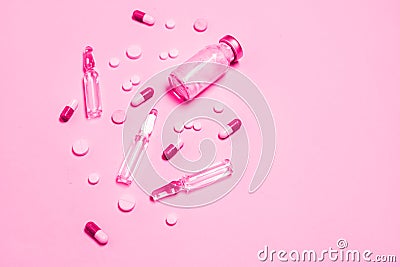 Vaccine and syringe, assorted pharmaceutical medicine pills, tablets and capsules background. Healthcare and medical Stock Photo
