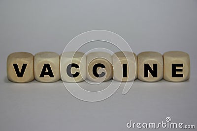 Vaccine Title - Wooden Cubes Concept - White Background Stock Photo