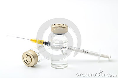 Vaccines, botulinum toxin and insulin ampules concept theme with glass vials with clear liquid next to a syringe and a hypodermic Stock Photo