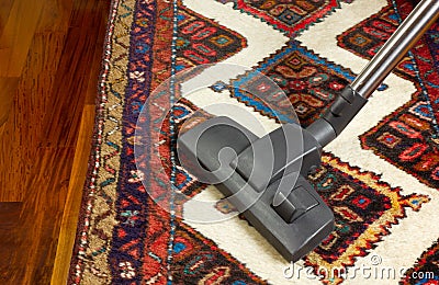 Vacuum Cleaner on a Carpet Stock Photo