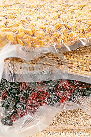 Vacuuming products for long term storage.Storage of products in vacuum bags.Stocks of provisions.cereals, pasta,nuts and Stock Photo