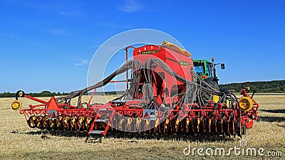 Vaderstad Spirit 600C Seed Drill and John Deere 7340 Tractor Editorial Stock Photo