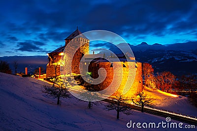 Illuminated castle of Vaduz, Liechtenstein at sunset - popular landmark at night Stock Photo