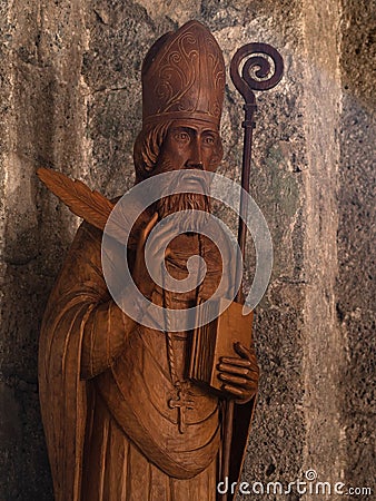 VAGLI SOTTO, LUCCA, ITALY AUGUST 9, 2019: Old carved statue of St Augustine to whom the small church in Vagli Sotto is Editorial Stock Photo