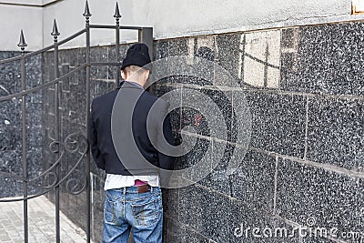 Vagrant peeing Stock Photo