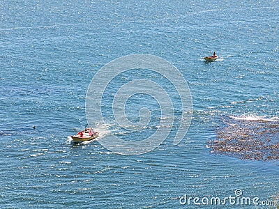 A motor boat fishermen return to Valdivia river after fishing in the Pacific Ocean. Valdivia, Region of the rivers, in the south Editorial Stock Photo