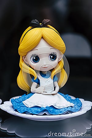 Valence, France - August 19, 2020 - Plastic figurine of Disney Princess Alice in Wonderland Editorial Stock Photo